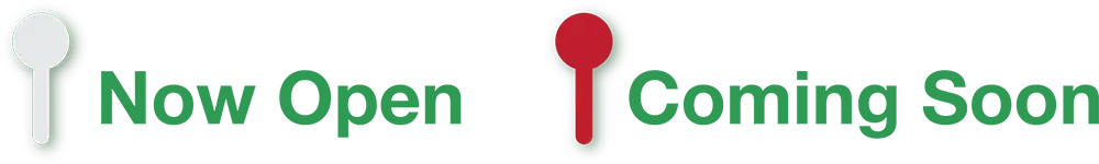 A series of three golf tees on a green background: the first tee is white, the second is red, and the third is green. Each tee stands upright in a row, evenly spaced. The vibrant scene might inspire a visit to nearby restaurants for those seeking Mediterranean flavors.